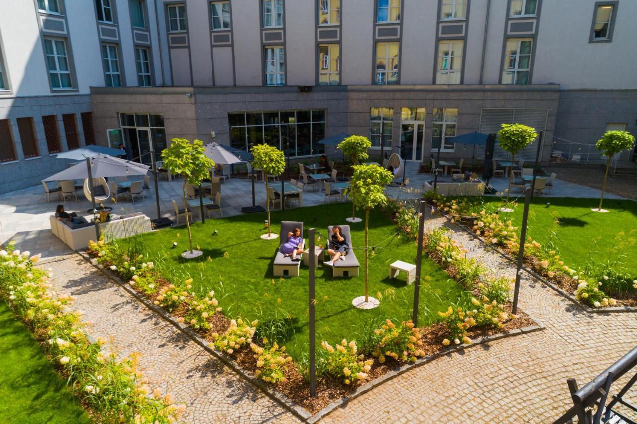 Radisson Blu Hotel Wroclaw Exterior photo The courtyard of the University of Luxembourg's Maison du Savoir