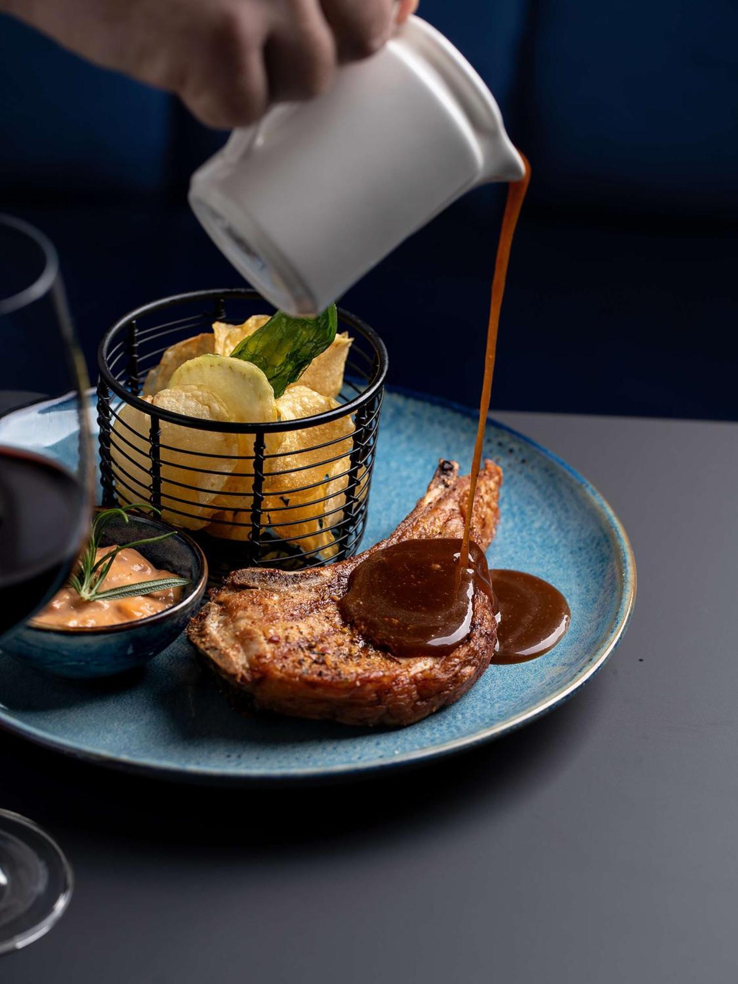Radisson Blu Hotel Wroclaw Exterior photo A steak with a side of mashed potatoes and a sauce
